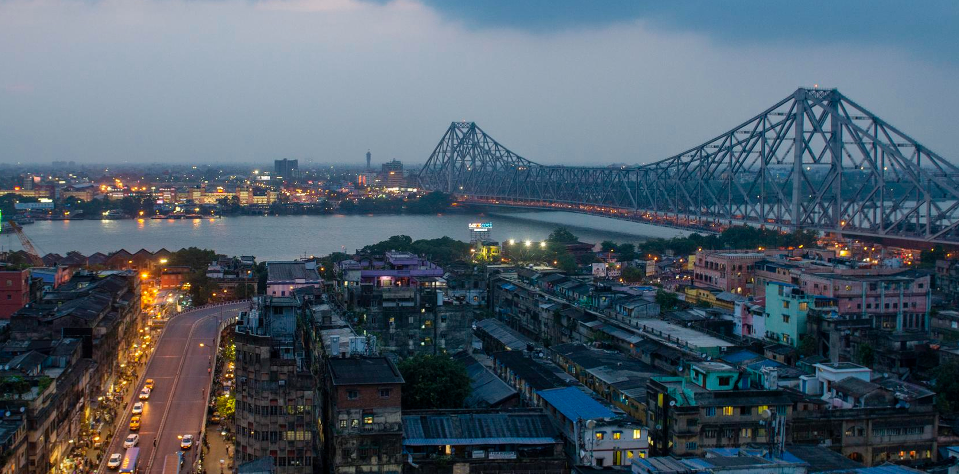 Chris standing up holding his daughter Elva