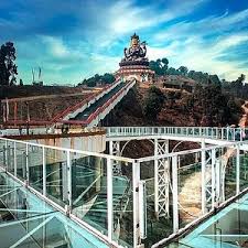 Chris standing up holding his daughter Elva