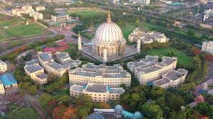 Chris standing up holding his daughter Elva